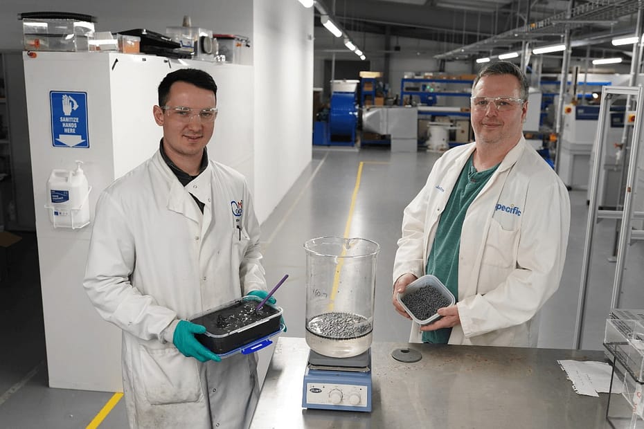 Jack Reynolds and Jon Elvins in a lab holding a box of the alginate beads